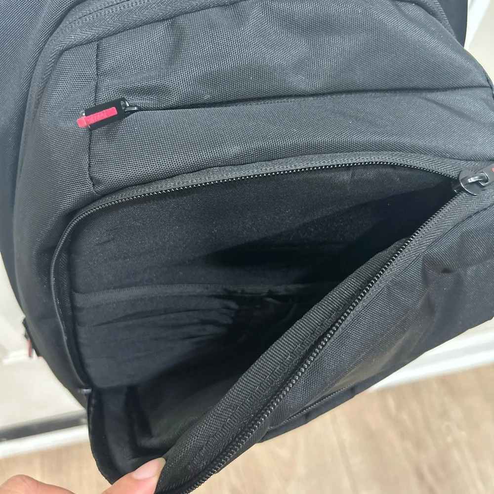 Compact Black Men's Backpack with Subtle Red Accents